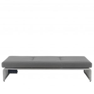 Grey cushioned bench with wide metal base and outlets for charging phones and laptops