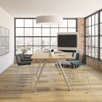 Office meeting room with long rectangular table, mobile whiteboard, and side chairs