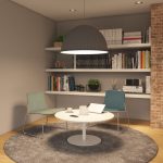 private room with a book shelf full of books and decoration. In the center we see a small coffee table in white color with a laptop and coffee mug on it. Around there are 2 montara650 chairs in blue and green colors