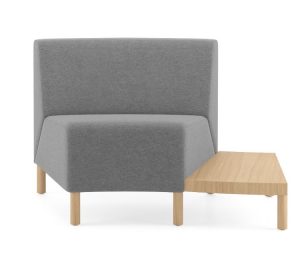 Corner lounge seat with grey upholstery and attached wooden side chair