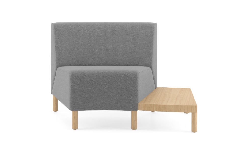 Corner lounge seat with grey upholstery and attached wooden side chair