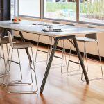 side view of a potrero415 table with 6 stools around it