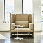 White Lagunitas Personal Table in front of a beige sofa