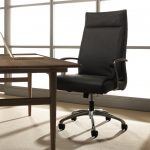 High back leather conference room chair at a wooden table