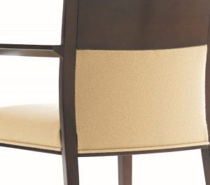 Back of office armchair with cream-colored cushion and dark wooden frame