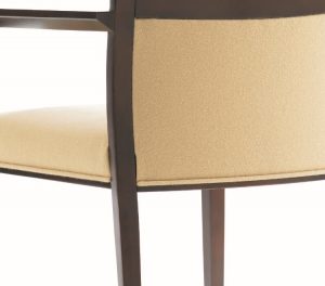 Back of office armchair with cream-colored cushion and dark wooden frame