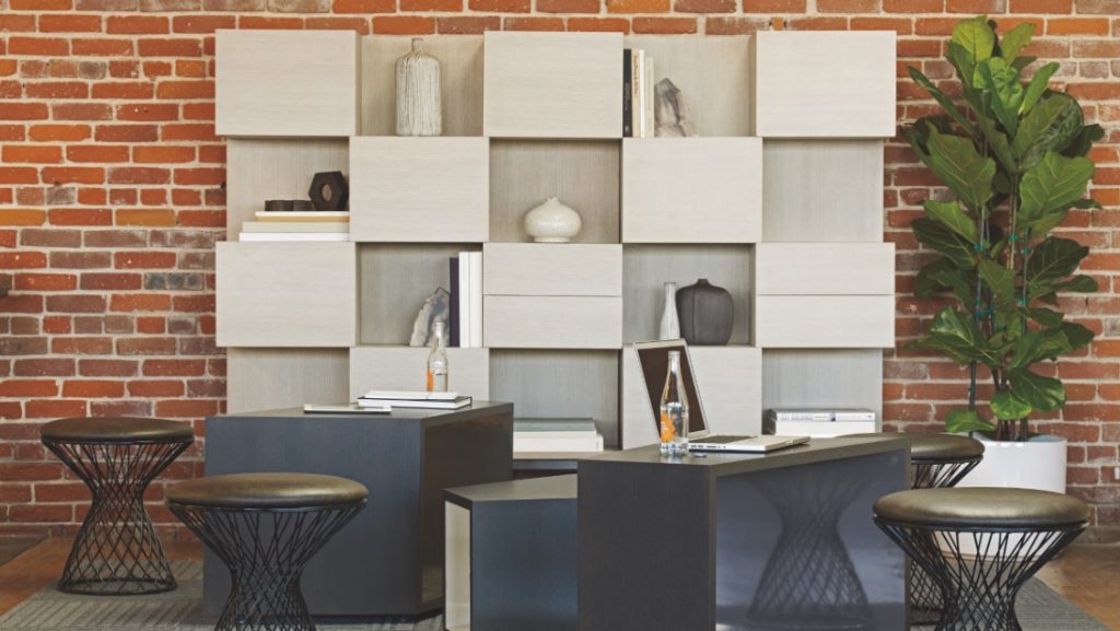 White office storage tower holding books, vases, and other decorations