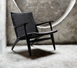 Black handmade outdoor chair with woven back and seat