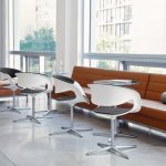 White office side chairs with glass coffee tables and burnt orange sectional sofa & bench