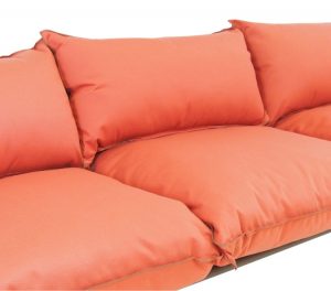 Orange sofa cushions on metal sofa base