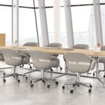 White office meeting room with oblong wooden meeting table and matching grey mobile conference chairs