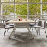 Grey side chairs and wooden coffee table in office social space