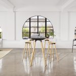 Long grey office conference table with wooden legs and matching stools in front of an arched window