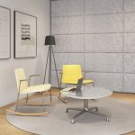 Lounge space in office with two yellow office rocking chairs and soundproof wall