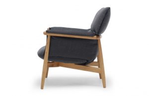 Wooden armchair with grey plush arms, back, and seat cushion