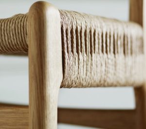 Woven seat and wooden base of office side chair