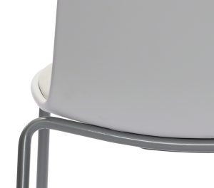 Back of white office side chair detailing how base connects to seat and back