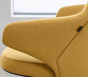 Armrest and cushion on office lounge chair, upholstered in yellow