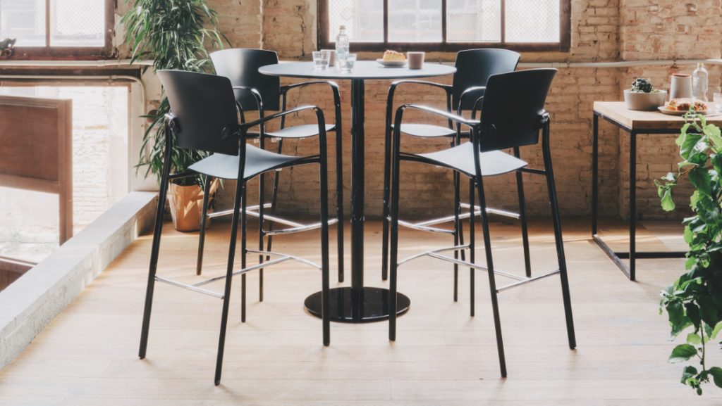 Cafe height bar stools in black with matching legs and armrests