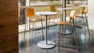 Mixed material office cafe furniture with cafe-height tables and cafe chairs with yellow back and seats