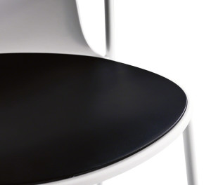 Close-up corner of office side chair with white material and black upholstered cushion
