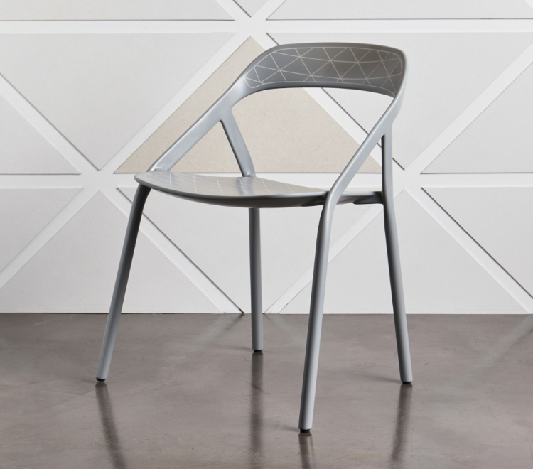 Light grey office side chair with detail of triangular pattern on seat back