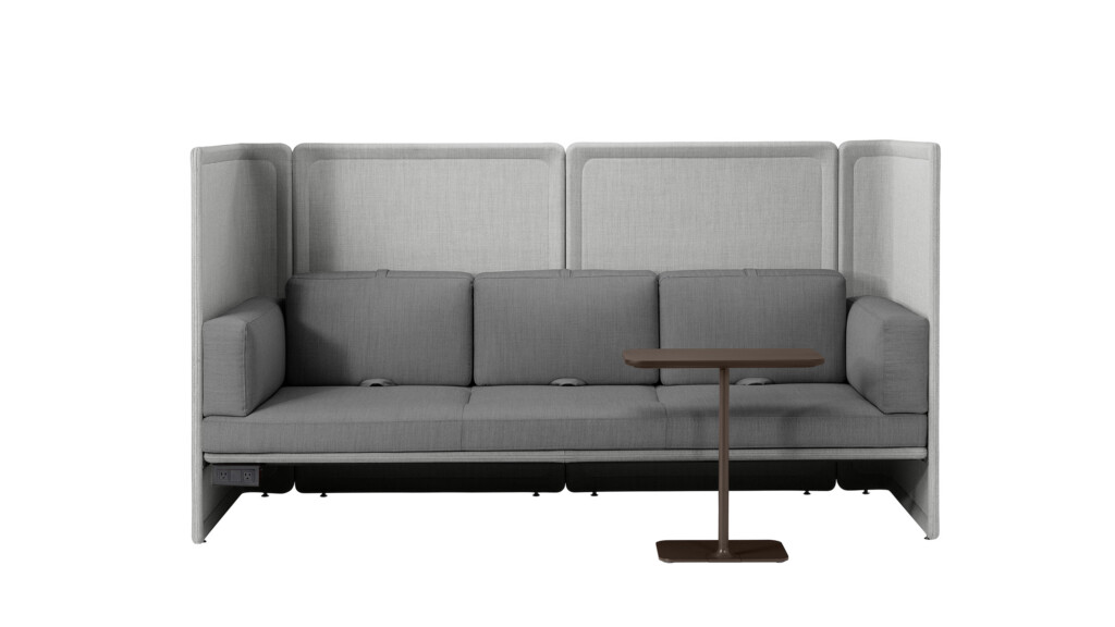 Front view of sofa with integrated side arms and a small freestanding table