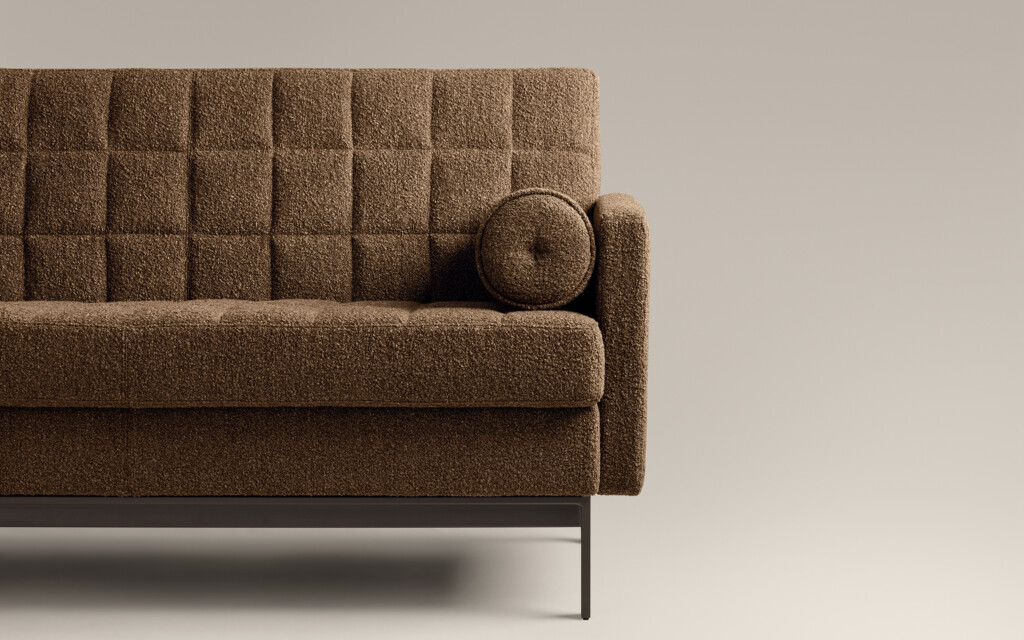 half of a Millbrae contract sofa in brown