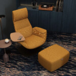 Modern lounge chair with ottoman, side table, and floor lamp in contemporary interior setting