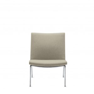 Wide and short side chair with grey upholstery and polished aluminum base and legs