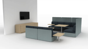 Modern lounge booth with blue upholstered seating, side tables, wall-mounted screen, and storage cabinet