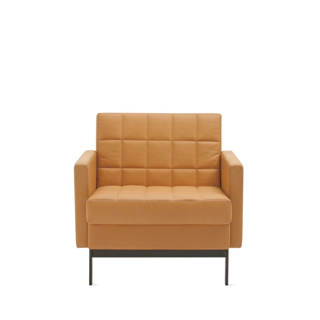 Mid-back midcentury modern office chair with stitched back, armrests, and light brown upholstery