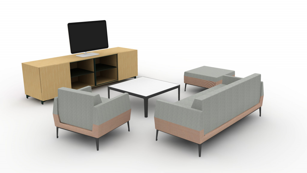 Office social space with matching couch, chair, and ottoman and wooden tables and cabinets