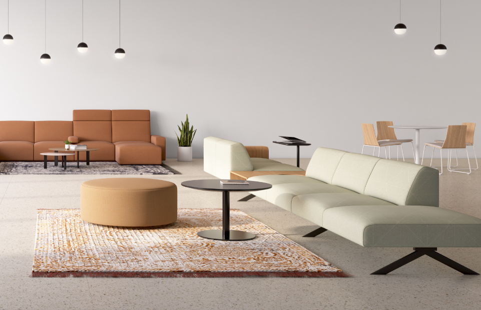 Office social space with contemporary armless sectional sofas, bench seating, ottomans, and tables