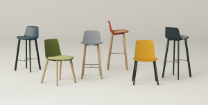 Grouping of office chairs and stools of various heights and colors