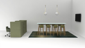 Modern collaborative workspace with privacy booths, meeting table, stools, and wall-mounted screen
