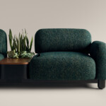 Coalesse Ensemble Lounge sofa in emerald green with a plant in the middle