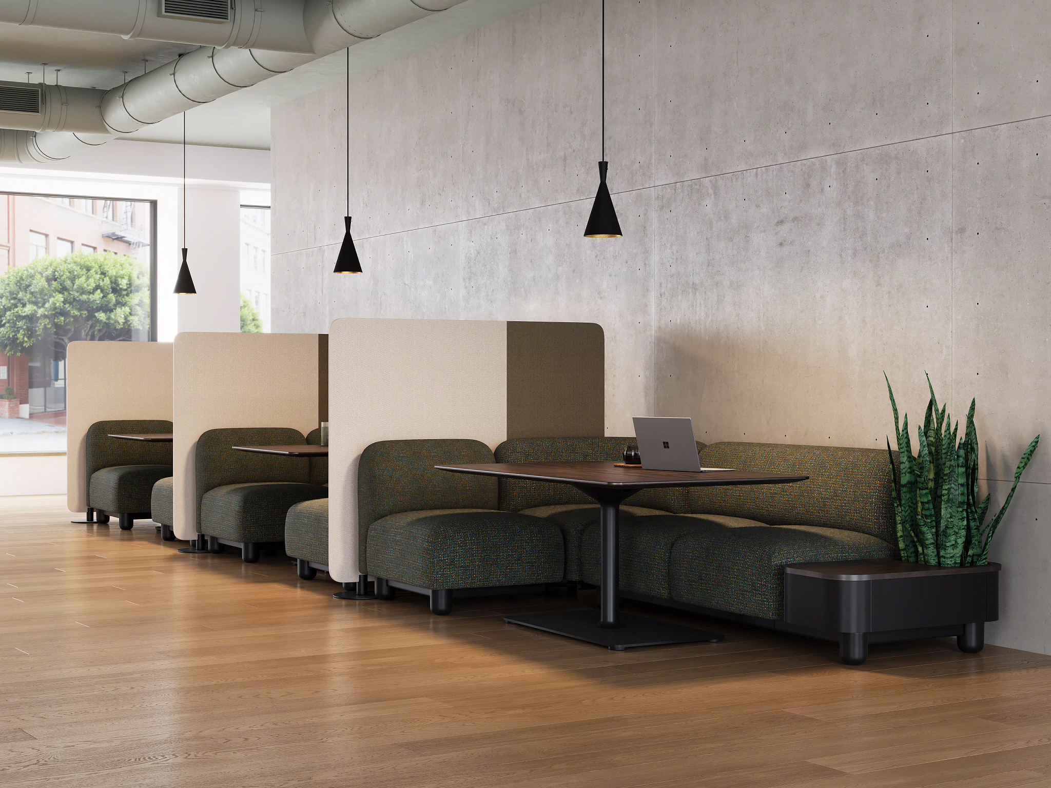 Private booth seating with upholstered benches, wood tables, and pendant lighting in modern workspace