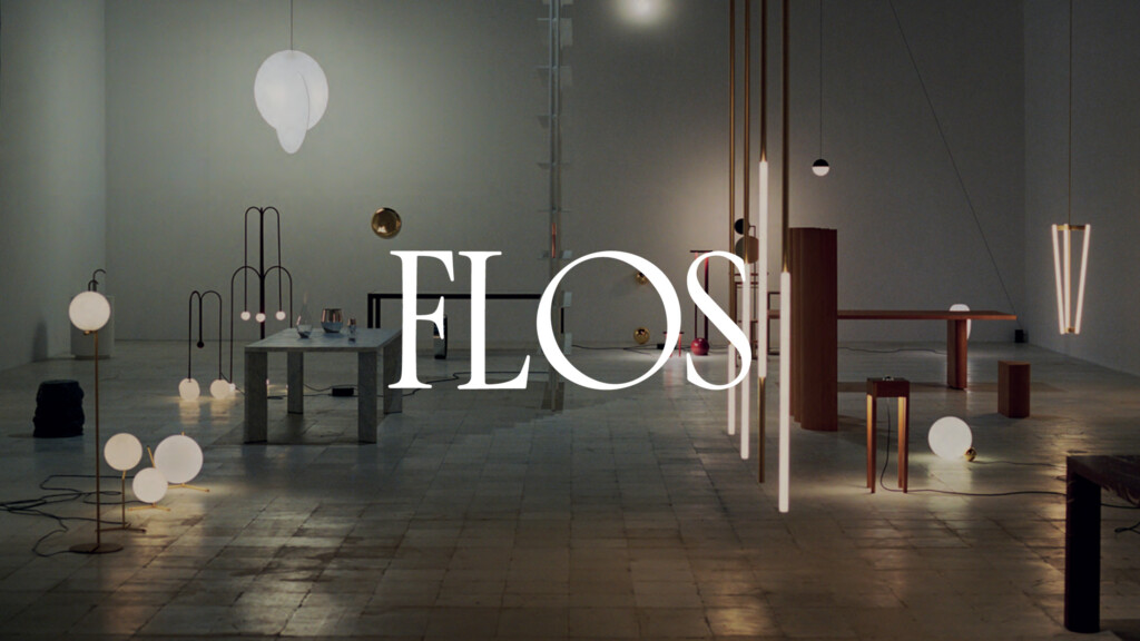 Minimalist interior showroom featuring modern lighting fixtures and furniture for the partner FLOS.
