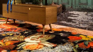 Wooden sideboard with tapered legs placed on a patterned floral rug
