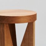 Close up view Cugino wooden stool on neutral background.