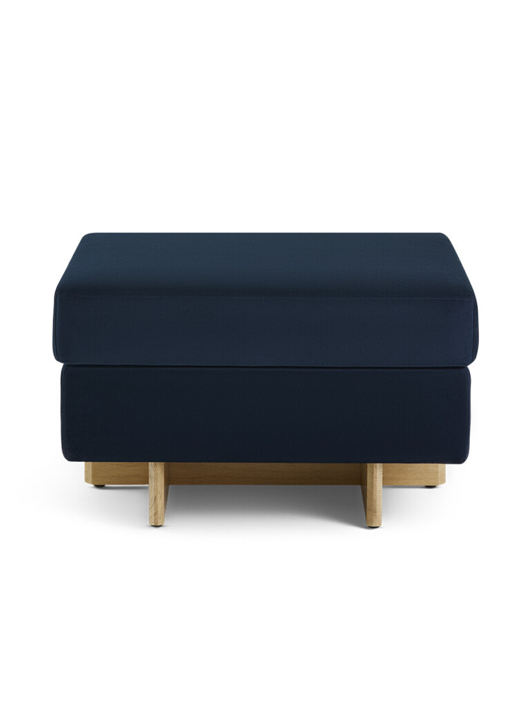 Galesburg footstool in dark blue on white background.