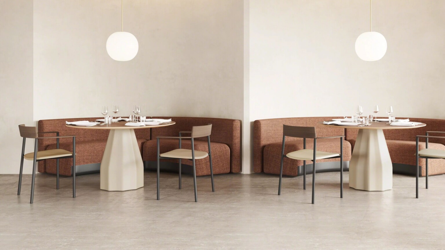 Seating areas with round tables, chairs and benches in a neutral dining space.