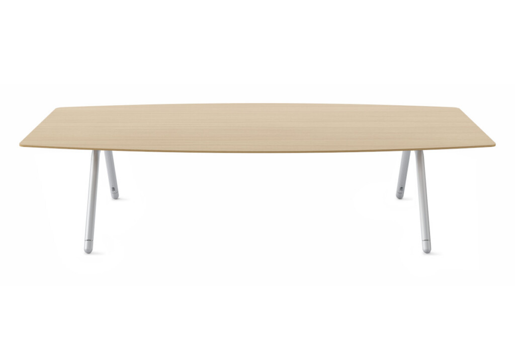 Large wood table with white angled metal legs on neutral background