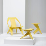Yellow Seating chair, stool and table set on a white background