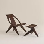 Dark wooden chair and footstool set on neutral background