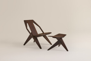 Dark wooden chair and footstool set on neutral background