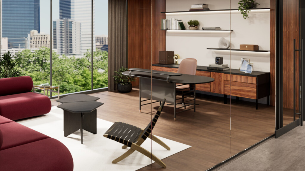 Modern office-style living space with a desk, lounge seating, and large windows overlooking a cityscape and trees.
