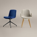 Blue and beige upholstered chairs against neutral background