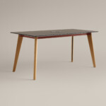 Wood table with integrated power outlet on neutral background